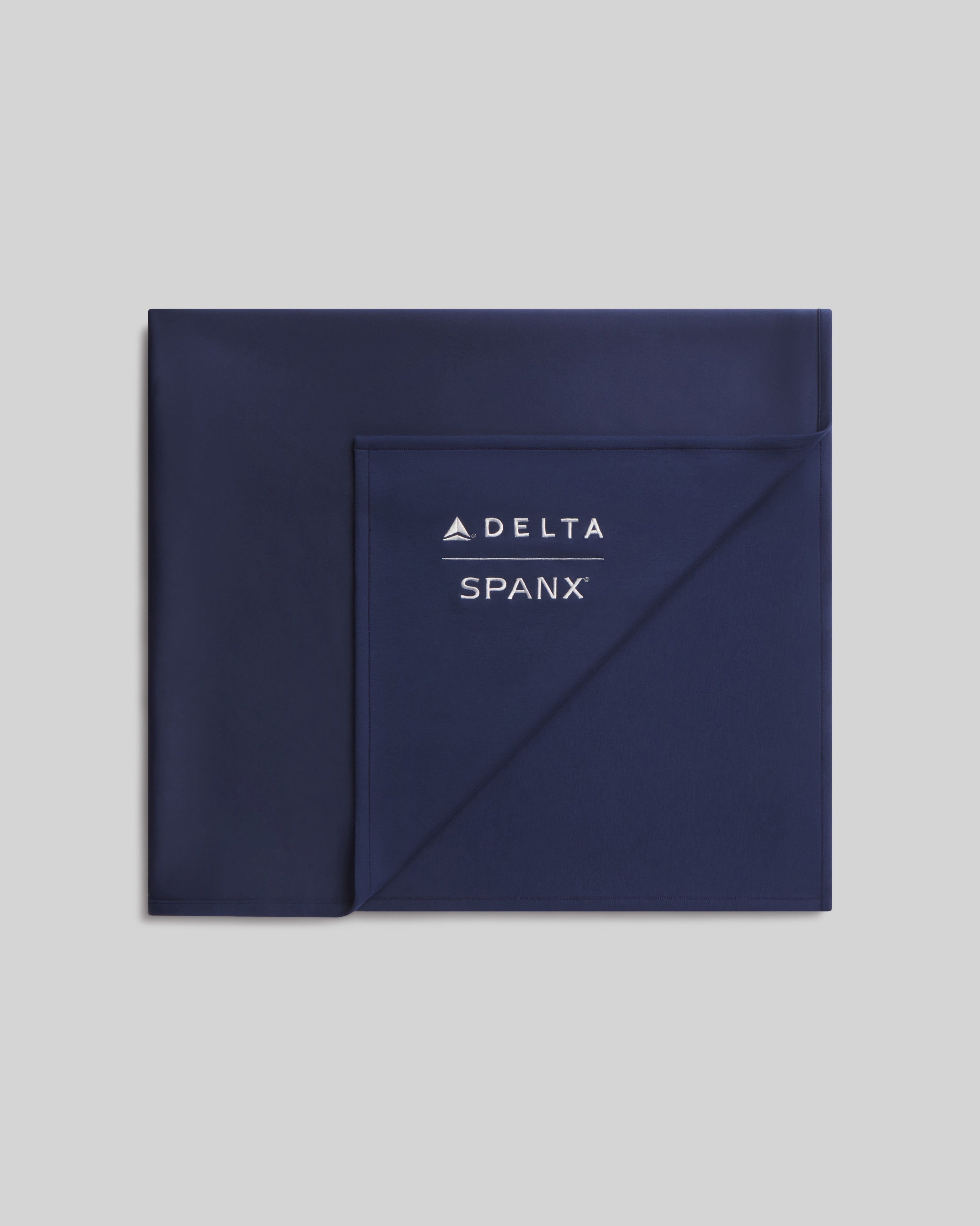 Delta x SPANX AirEssentials® Blanket  Timeless Navy